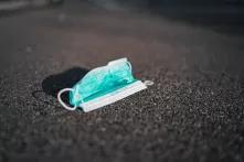 Medical face mask on the ground.