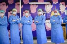  At the Frontline: Nurses with their protective equipments. 