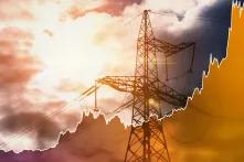 Transmission tower and raising sparkline chart representing electricity prices rise during global energy crisis.