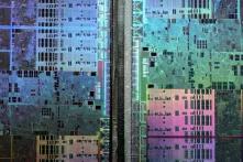 Abstract microscopic photography of a Graphics Processing Unit resembling a satellite image of a big city.