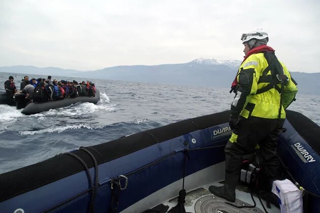 Refugees on a boat crossing the Mediterranean sea, heading from Turkish coast to the northeastern Greek island of Lesbos, January 29,  2016